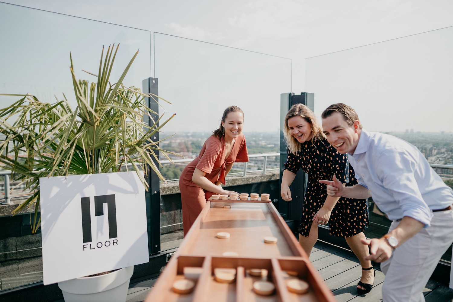 People playing shuffleboard